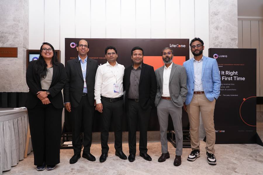 The LUMIQ and AWS team at the roundtable backdrop