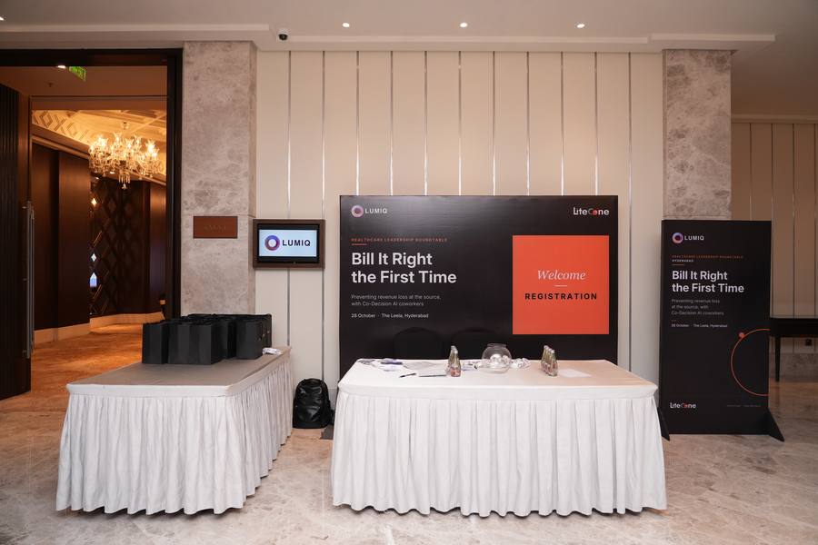Registration desk with the Bill It Right the First Time backdrop