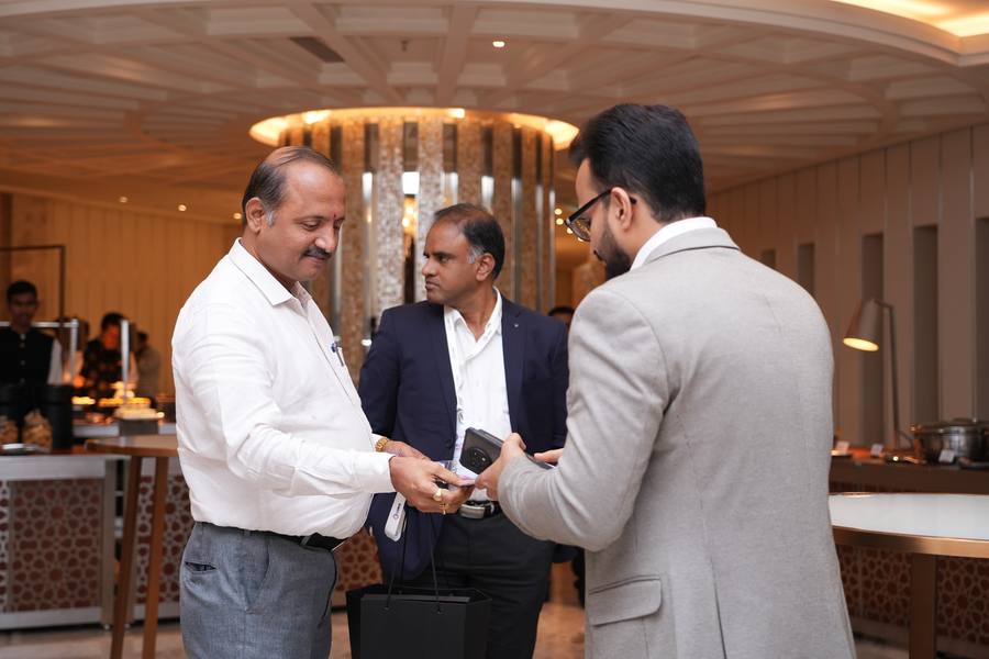 Guests exchanging contacts after the session
