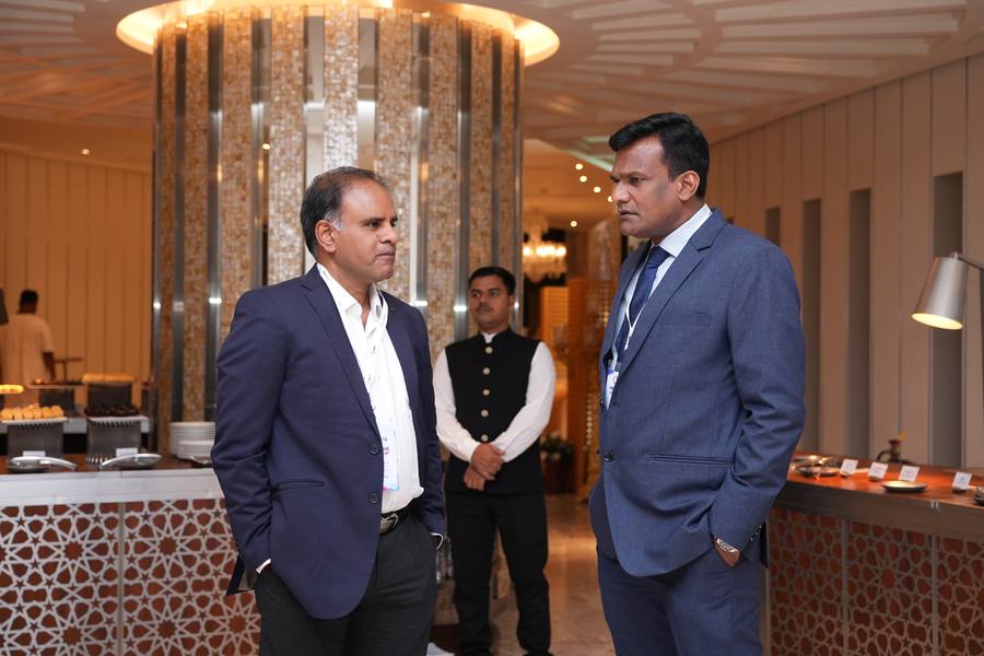 Two guests talking at dinner