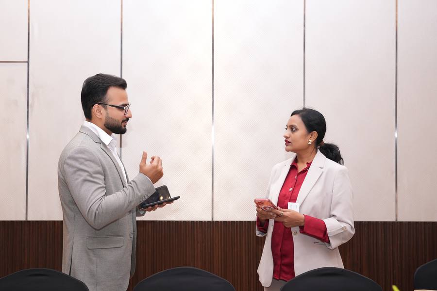 A LUMIQ team member with a guest after the session
