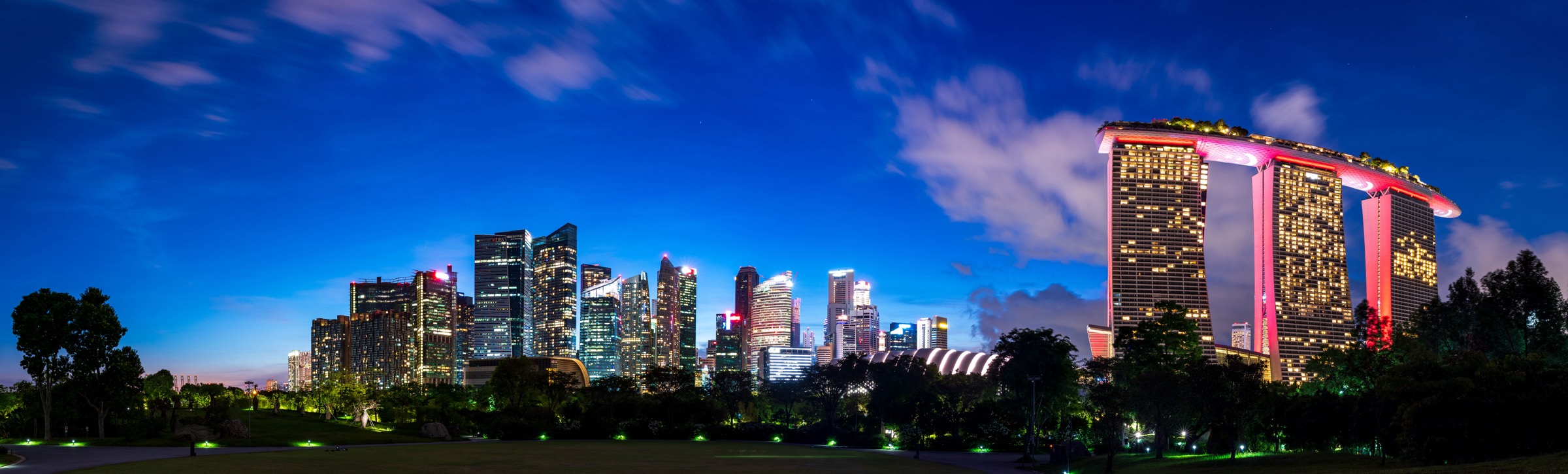 Marina Bay Sands and the Singapore city skyline at dusk, seen from Gardens by the Bay